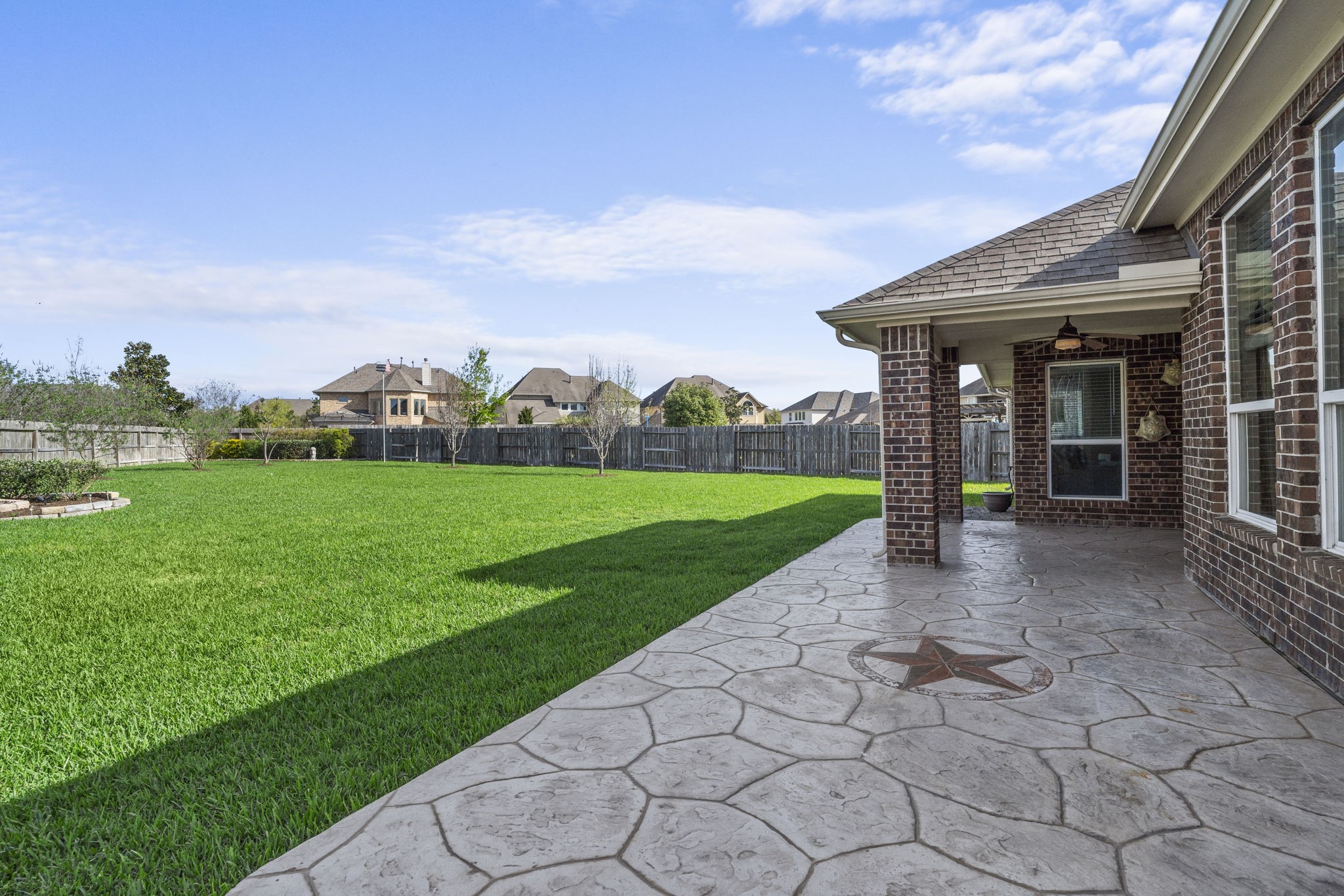 3426 Summer Ranch Drive Katy, TX 77494 - Photo 2 of 48 The extended covered patio provides plenty of room for seating and entertaining, creating a seamless transition between indoor comfort and outdoor living.