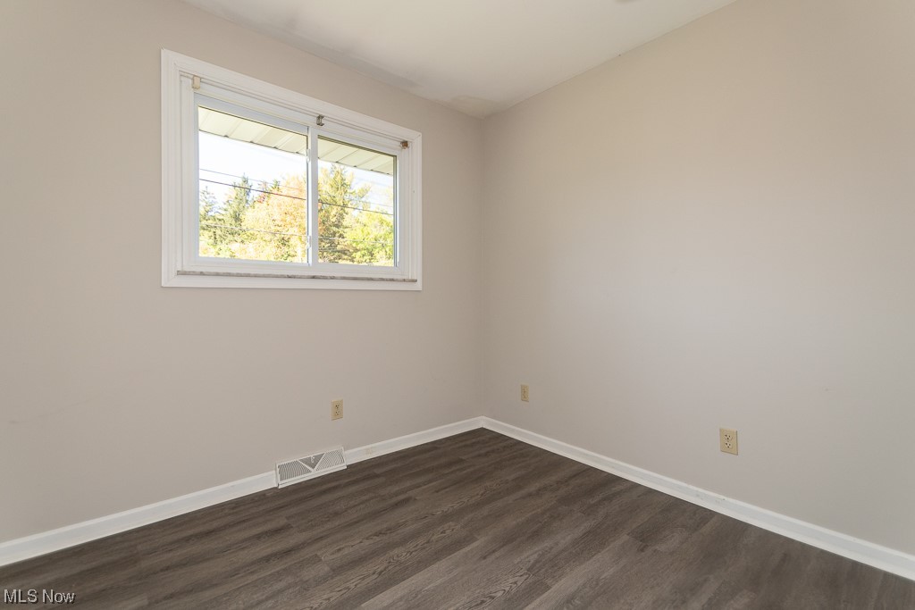308 Wilson Mills Road Chardon, OH 44024 - Photo 16 of 21 Unfurnished room featuring dark hardwood / wood-style flooring