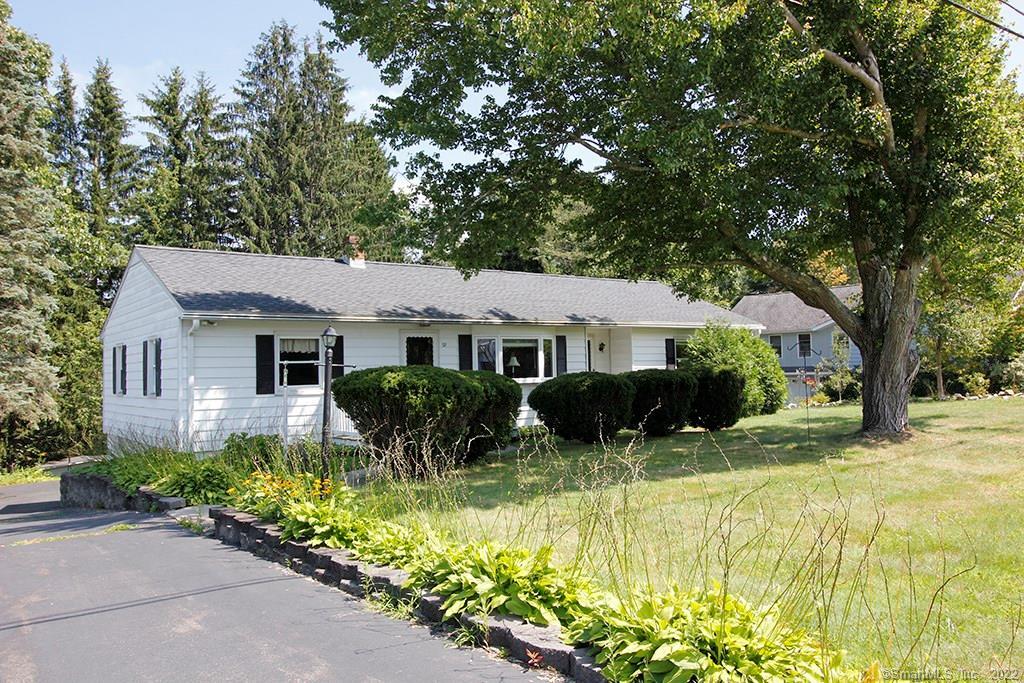 92 Joy Road Middlebury, CT 06762 - Photo 1 of 1 a front view of house with yard and trees around
