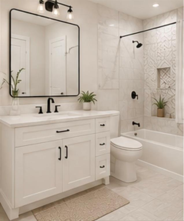 1730 Stargazer Court Denison, TX 75020 - Photo 5 of 9 a bathroom with a toilet a sink a mirror a bathtub and vanity