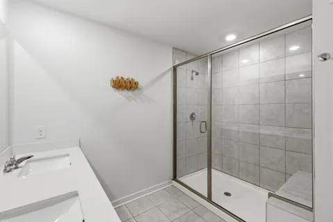 a bathroom with a shower and a sink