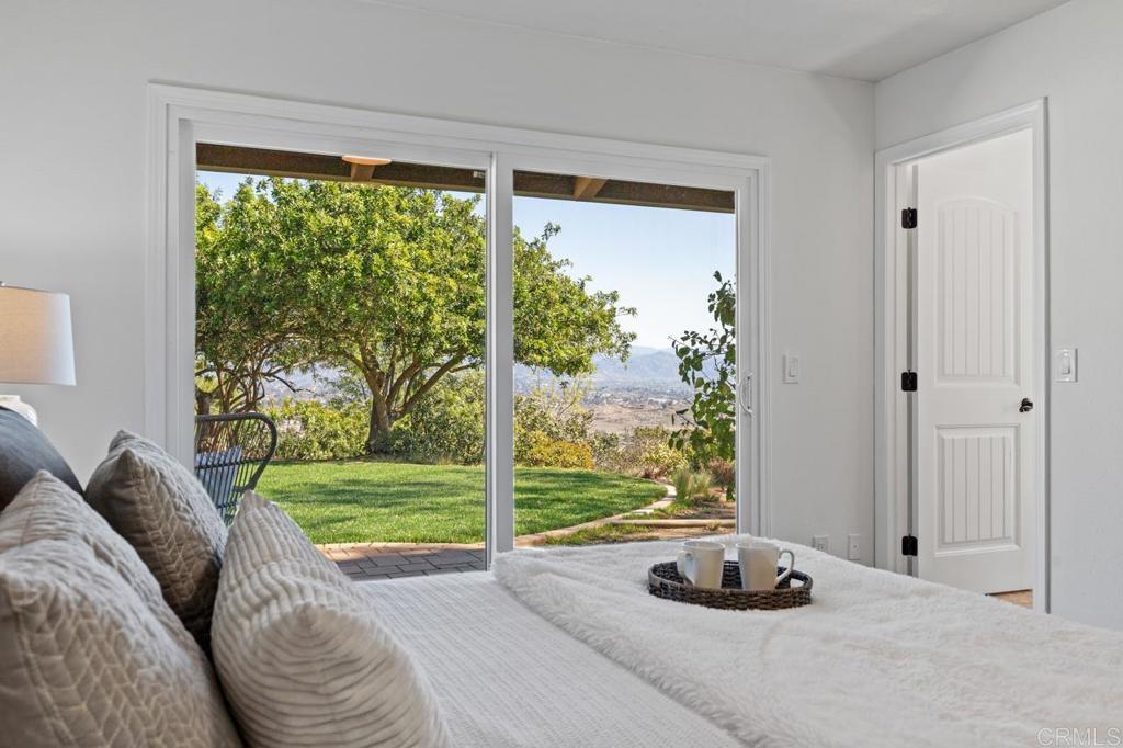 929 Cycad Drive San Marcos, CA 92078 - Photo 32 of 71 a bed sitting in a bedroom next to a window