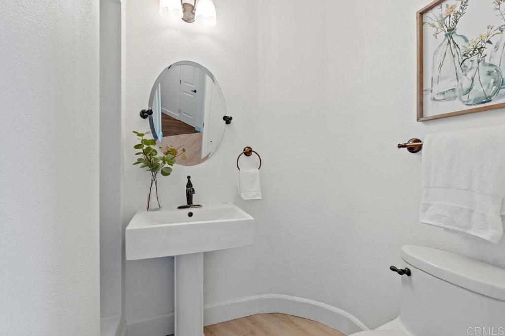 929 Cycad Drive San Marcos, CA 92078 - Photo 41 of 71 a bathroom with a sink mirror and vanity