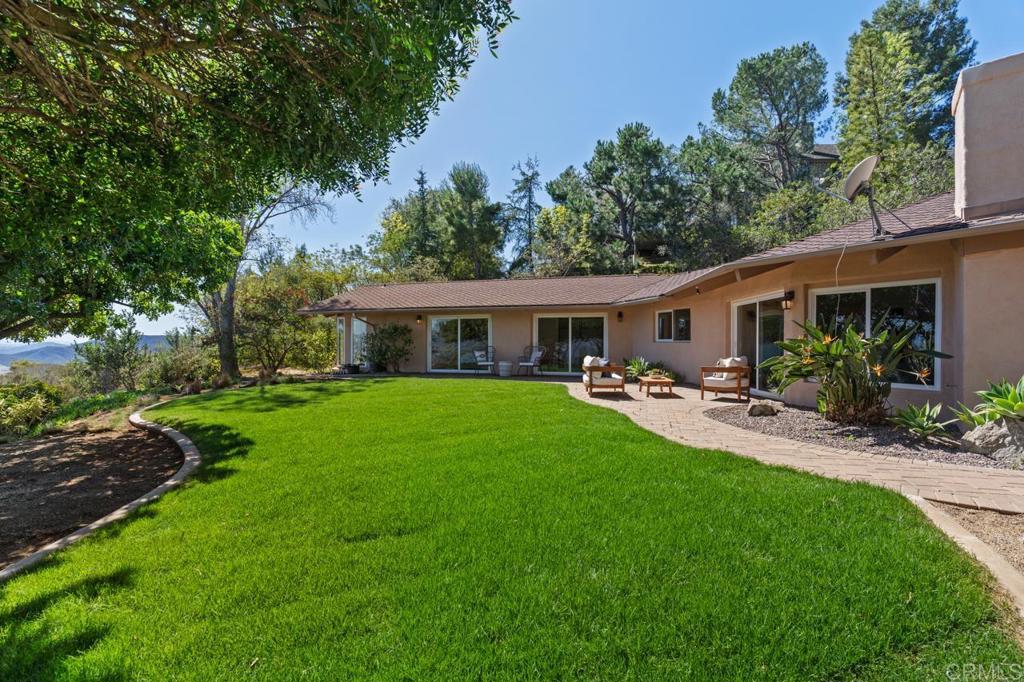 929 Cycad Drive San Marcos, CA 92078 - Photo 52 of 71 a front view of house with a garden and patio