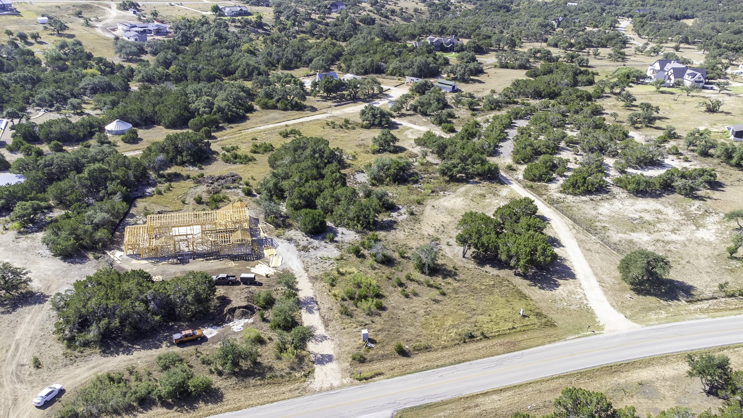 2251 West Fitzhugh Road Dripping Springs, TX 78620 - Photo 6 of 16 a view of a yard with wooden fence