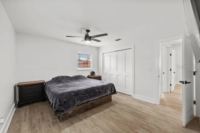 a bathroom with a double vanity sink a mirror and a toilet