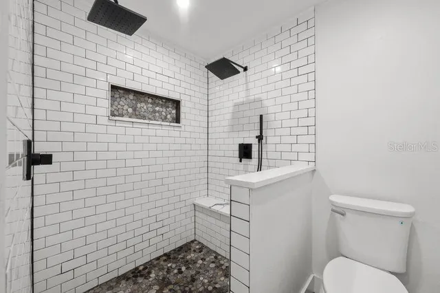 an empty room with a view of a kitchen