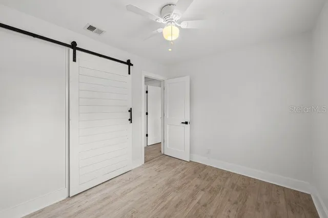 a bathroom with a double vanity sink mirror and toilet