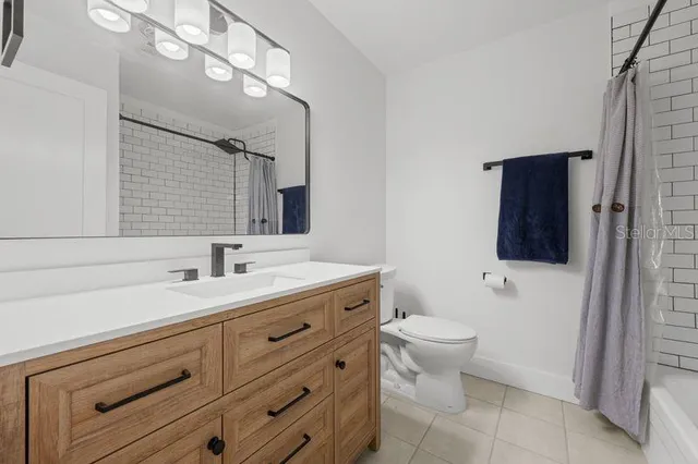 a view of a porch with furniture and a yard