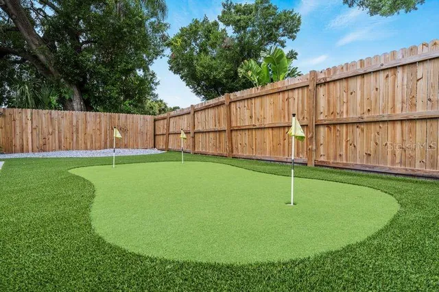 a view of a backyard with a garden and plants
