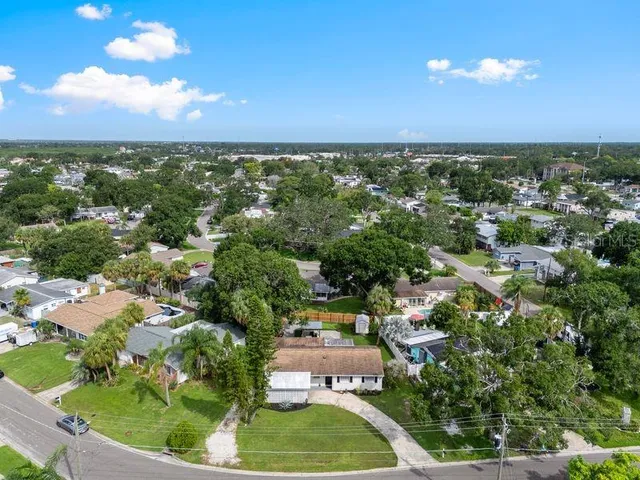 an aerial view of city and lake