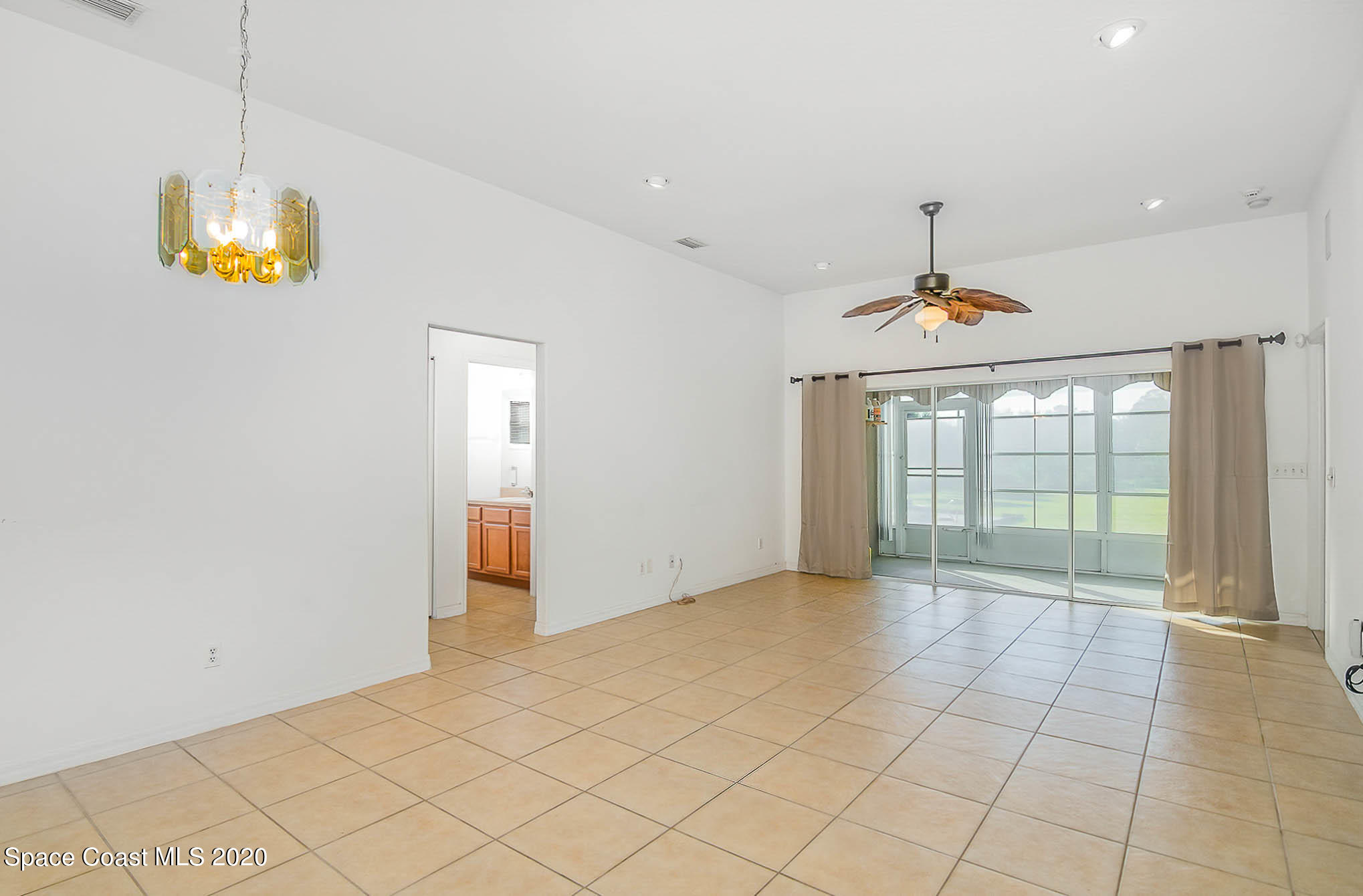 685 Hall Road Malabar, FL 32950 - Photo 8 of 35 a view of an empty room with a window