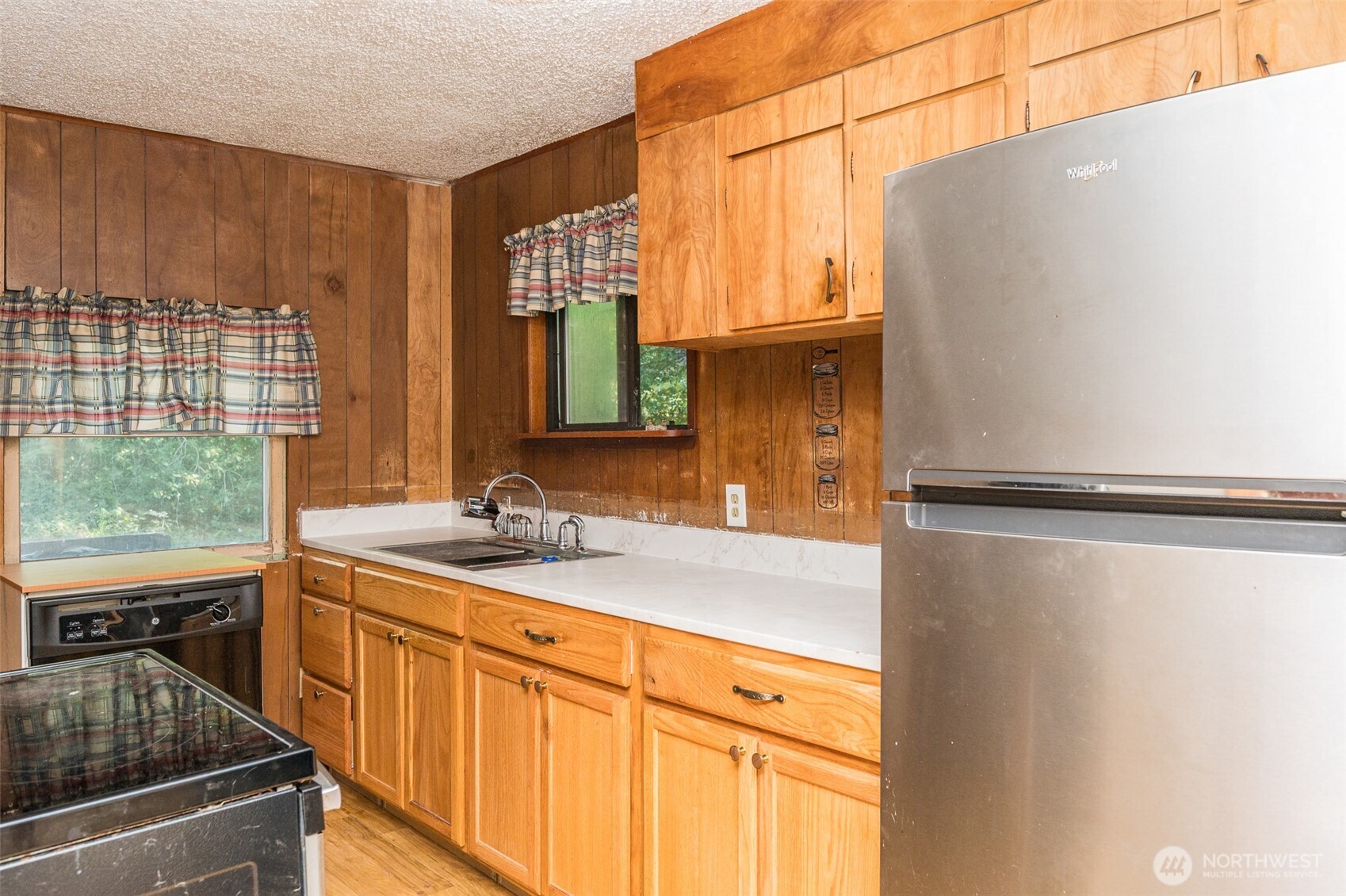 1671 Northeast Mission Creek Road Belfair, WA 98528 - Photo 11 of 31 a kitchen with stainless steel appliances a sink and a window