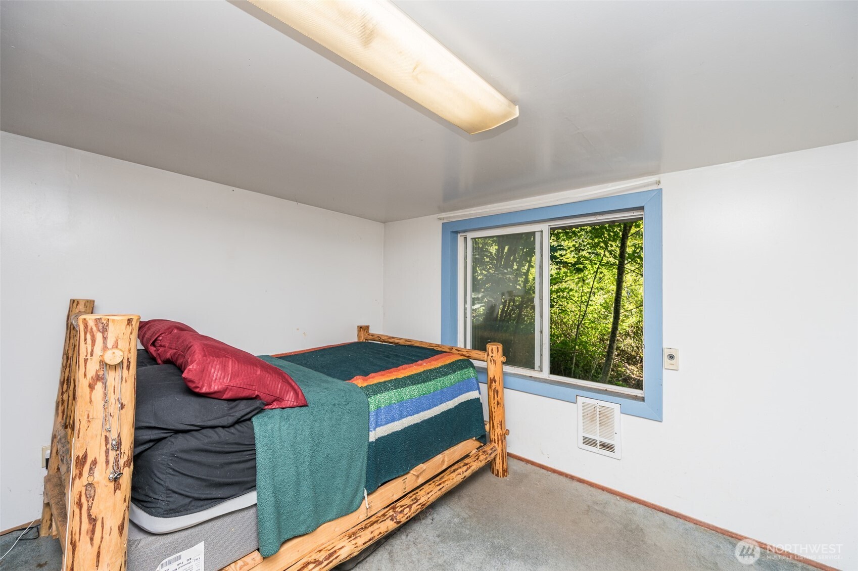 1671 Northeast Mission Creek Road Belfair, WA 98528 - Photo 12 of 31 a room with a bed and a window