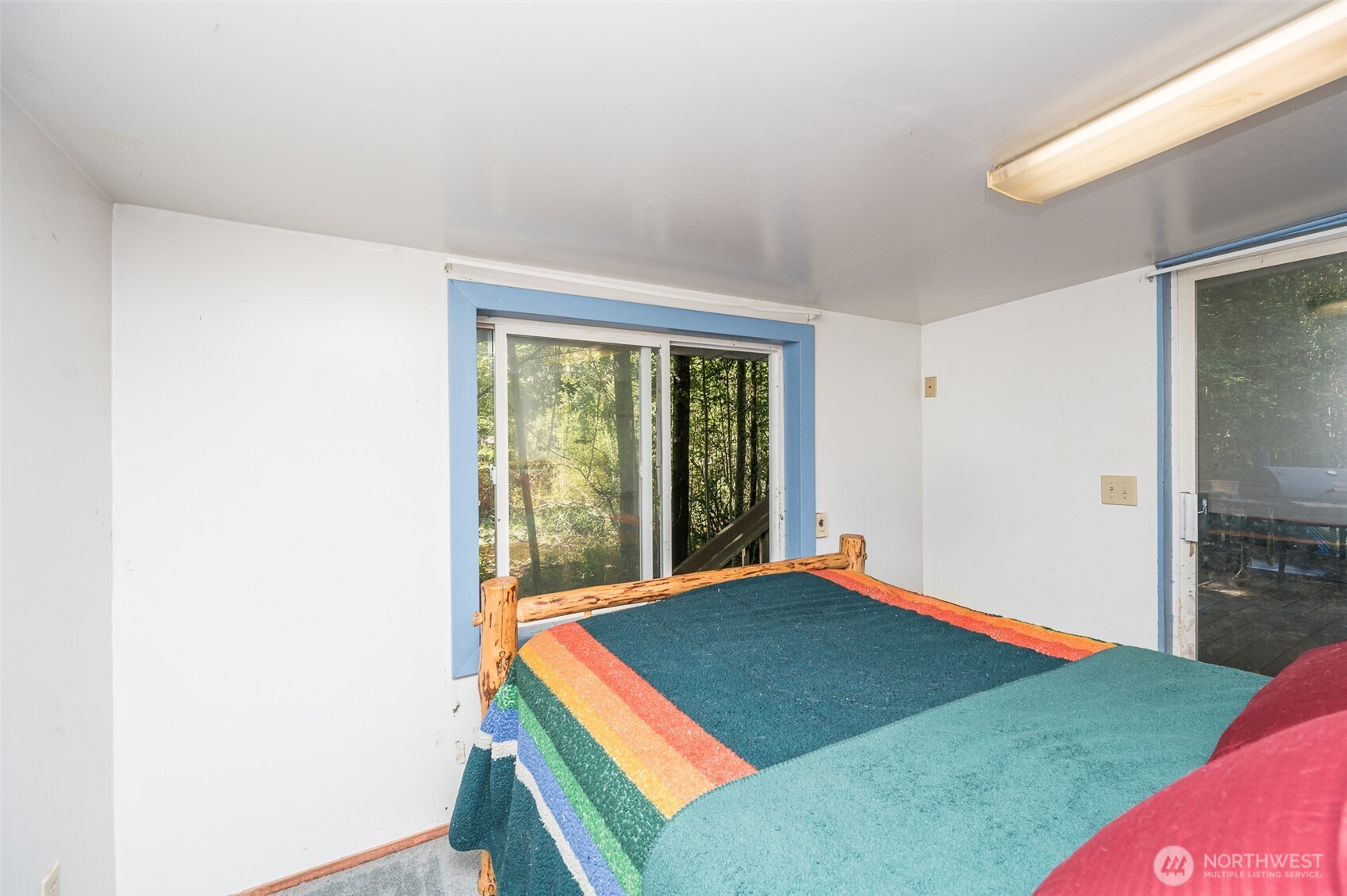 1671 Northeast Mission Creek Road Belfair, WA 98528 - Photo 13 of 31 a room with a bed and a view of bedroom