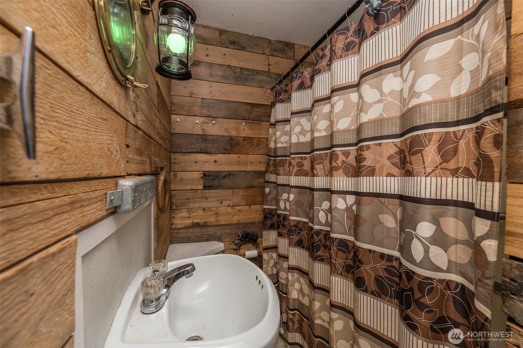 1671 Northeast Mission Creek Road Belfair, WA 98528 - Photo 14 of 31 a bathroom with a sink and mirror