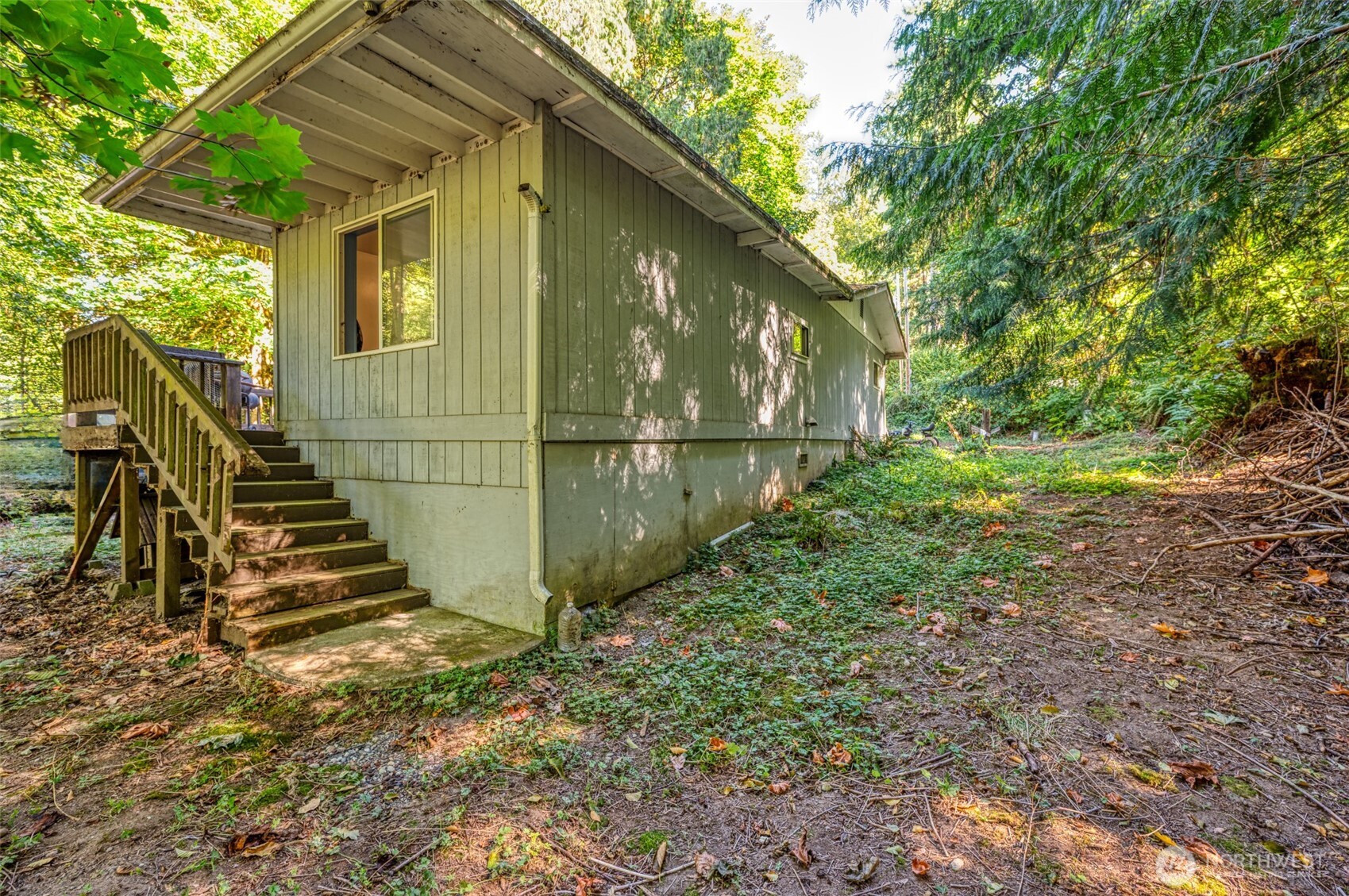 1671 Northeast Mission Creek Road Belfair, WA 98528 - Photo 20 of 31 a view of a backyard with stairs