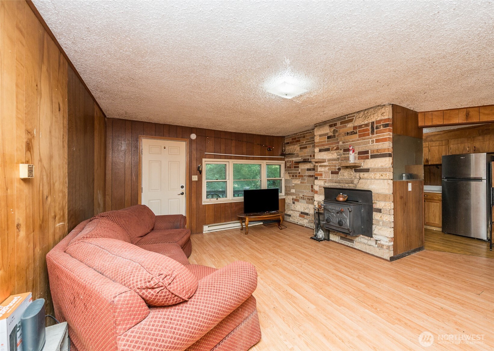 1671 Northeast Mission Creek Road Belfair, WA 98528 - Photo 4 of 31 a living room with furniture and a fireplace