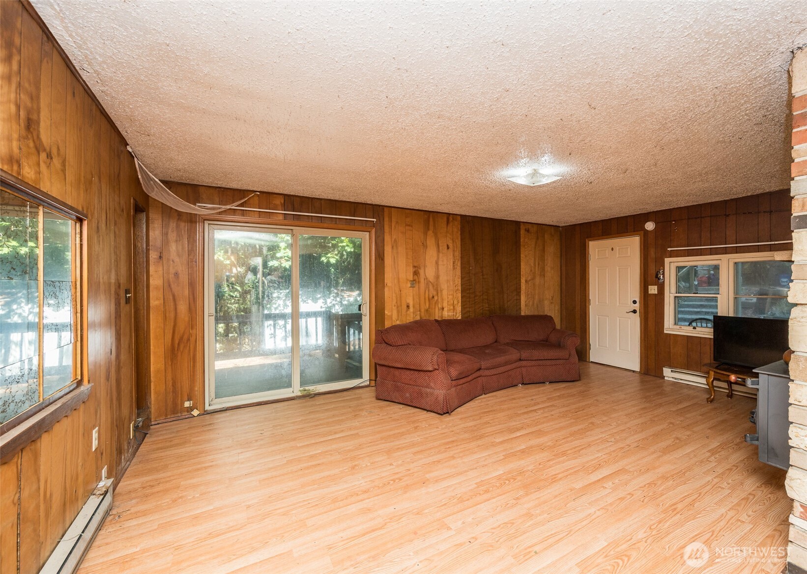 1671 Northeast Mission Creek Road Belfair, WA 98528 - Photo 6 of 31 a spacious bedroom with a large bed and a large window