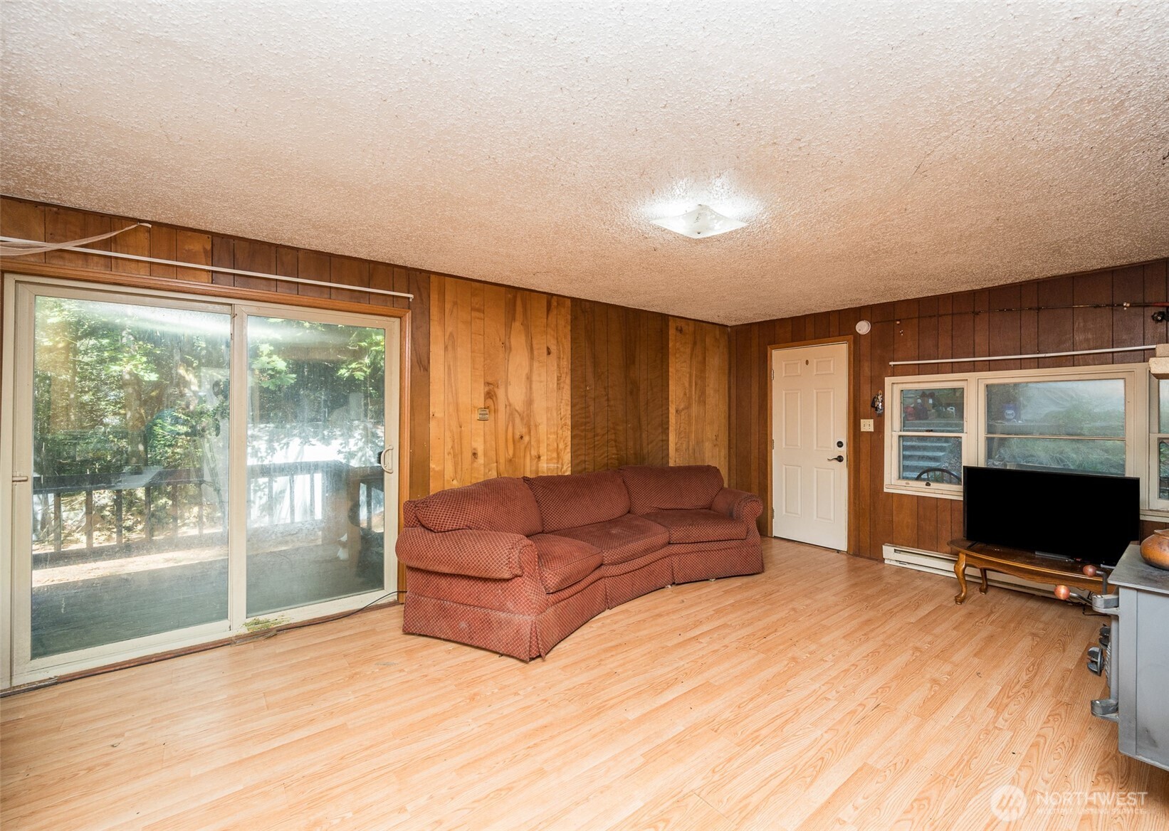 1671 Northeast Mission Creek Road Belfair, WA 98528 - Photo 7 of 31 a living room with furniture window and a flat screen tv