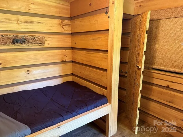a view of a red chairs in front of a fire pit