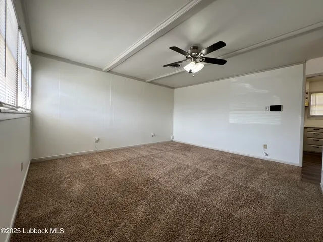 a view of a big room with carpet