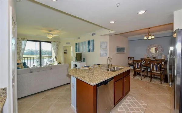 a living room with granite countertop furniture and a table