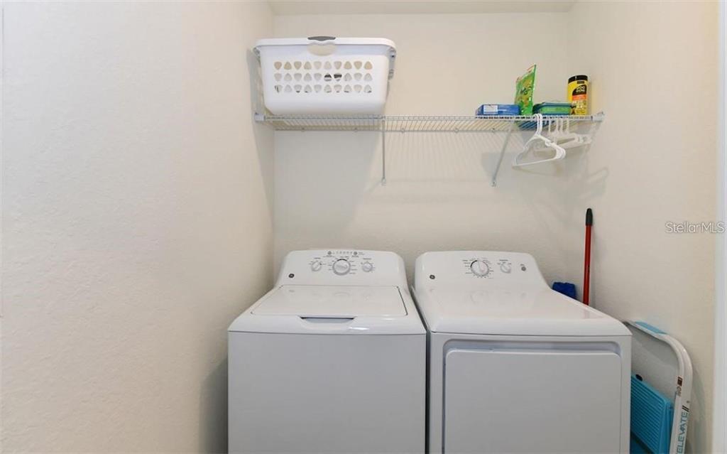 16904 Vardon Terrace, Unit 201 Lakewood Ranch, FL 34211 - Photo 21 of 35 a utility room with dryer and washer