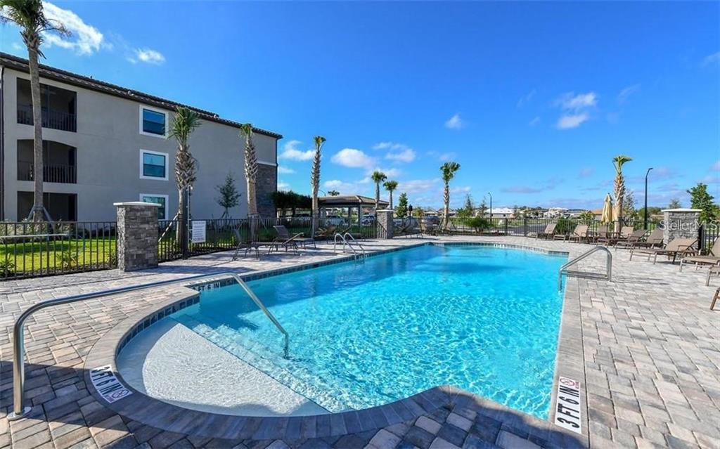 16904 Vardon Terrace, Unit 201 Lakewood Ranch, FL 34211 - Photo 27 of 35 a view of a swimming pool with outdoor seating