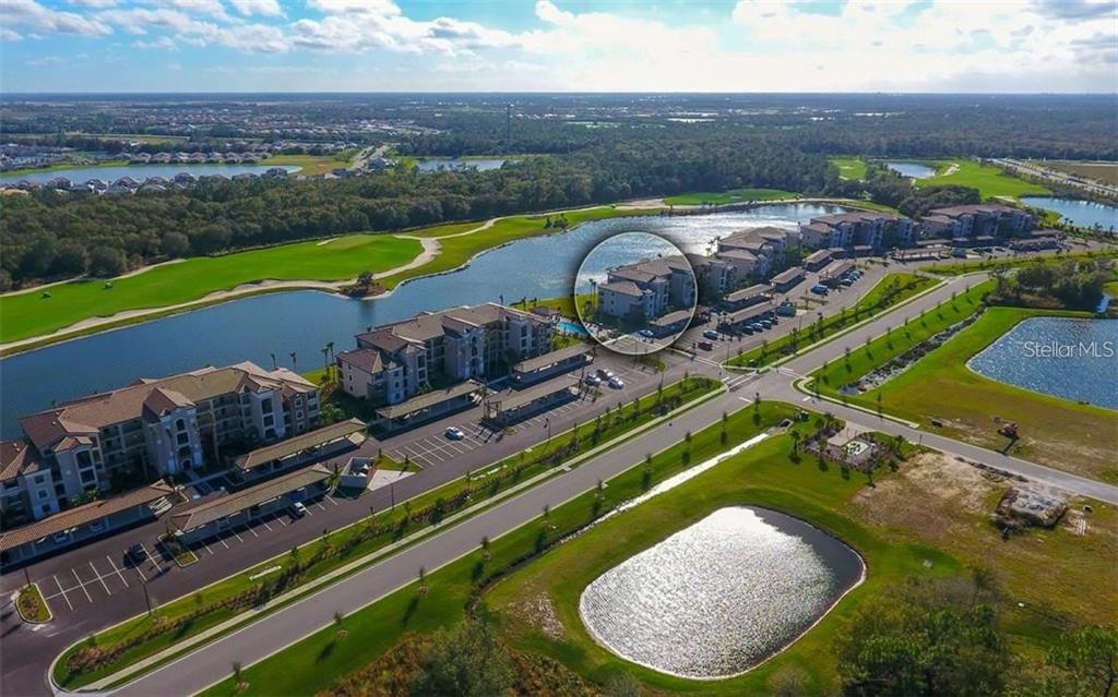 16904 Vardon Terrace, Unit 201 Lakewood Ranch, FL 34211 - Photo 32 of 35 an aerial view of a house with a swimming pool yard and outdoor seating