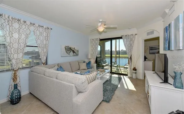 a living room with furniture fireplace and a flat screen tv