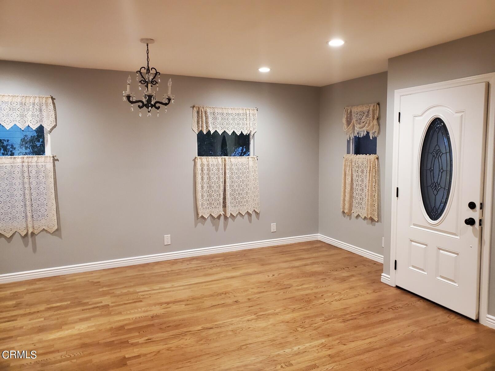 10651 Tinker Avenue Tujunga, CA 91042 - Photo 2 of 13 wooden floor in an empty room with a window