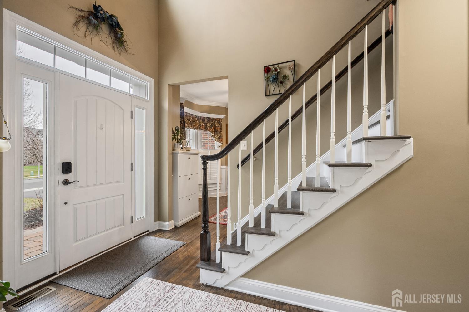 3 Milburne Lane Robbinsville, NJ 08691 - Photo 18 of 50 a view of an entryway with wooden floor and staircase