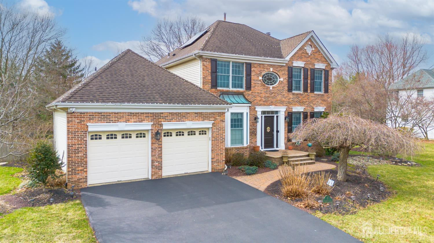 3 Milburne Lane Robbinsville, NJ 08691 - Photo 2 of 50 a front view of a house with a yard and garage