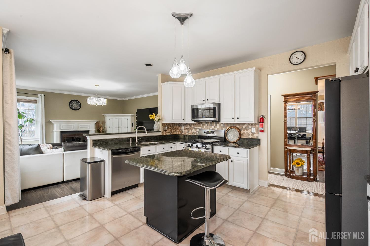 3 Milburne Lane Robbinsville, NJ 08691 - Photo 26 of 50 a kitchen with kitchen island granite countertop appliances cabinets and furniture