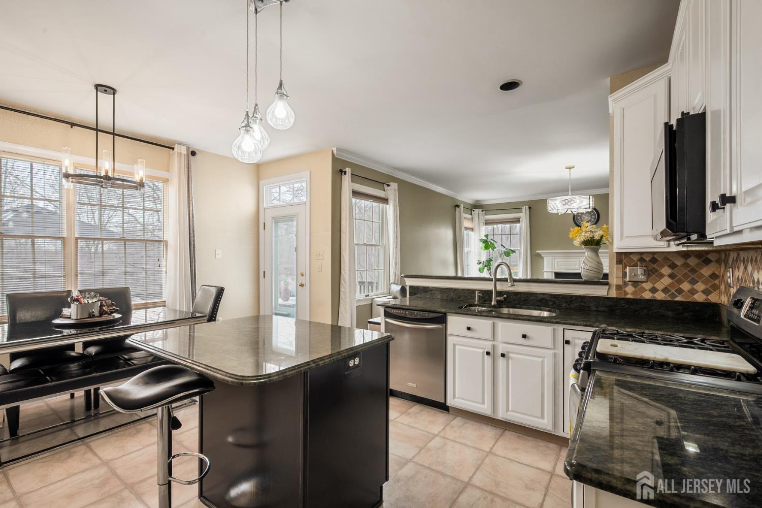 3 Milburne Lane Robbinsville, NJ 08691 - Photo 29 of 50 a kitchen with a sink stove and microwave
