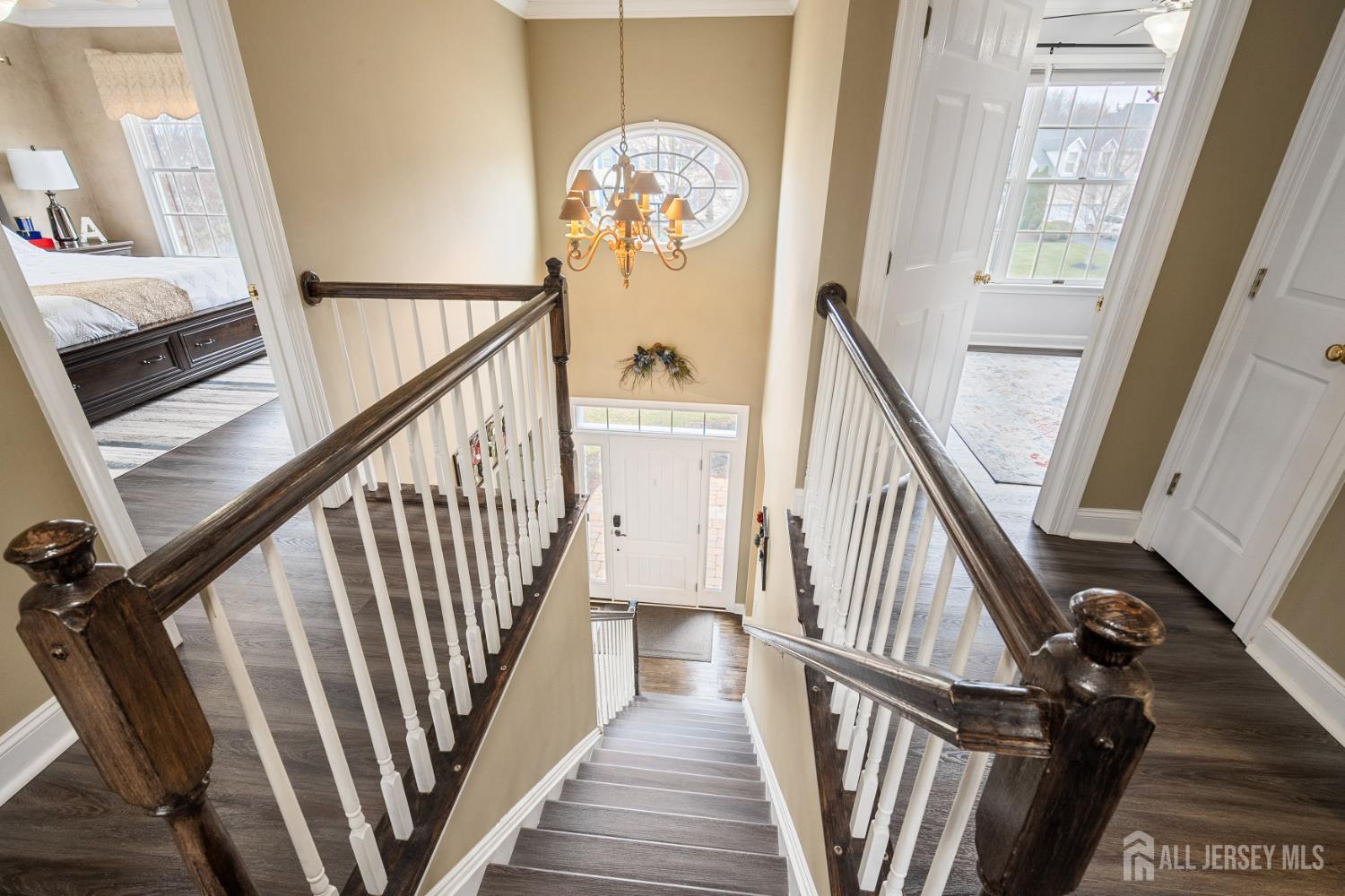 3 Milburne Lane Robbinsville, NJ 08691 - Photo 33 of 50 a view of a hallway with wooden floor and stairs