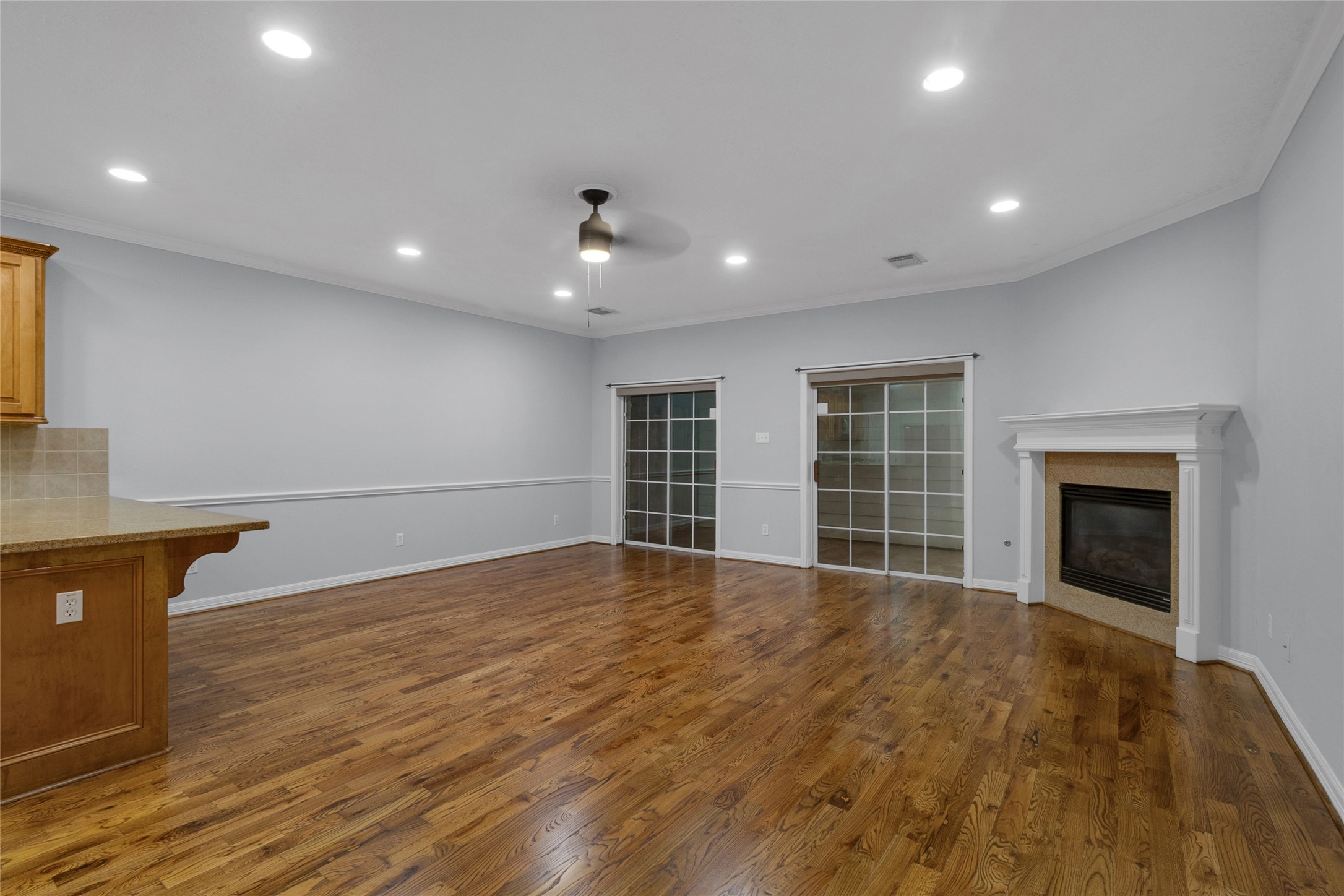 341 West 23rd Street Houston, TX 77008 - Photo 9 of 26 a view of an empty room with wooden floor and a window