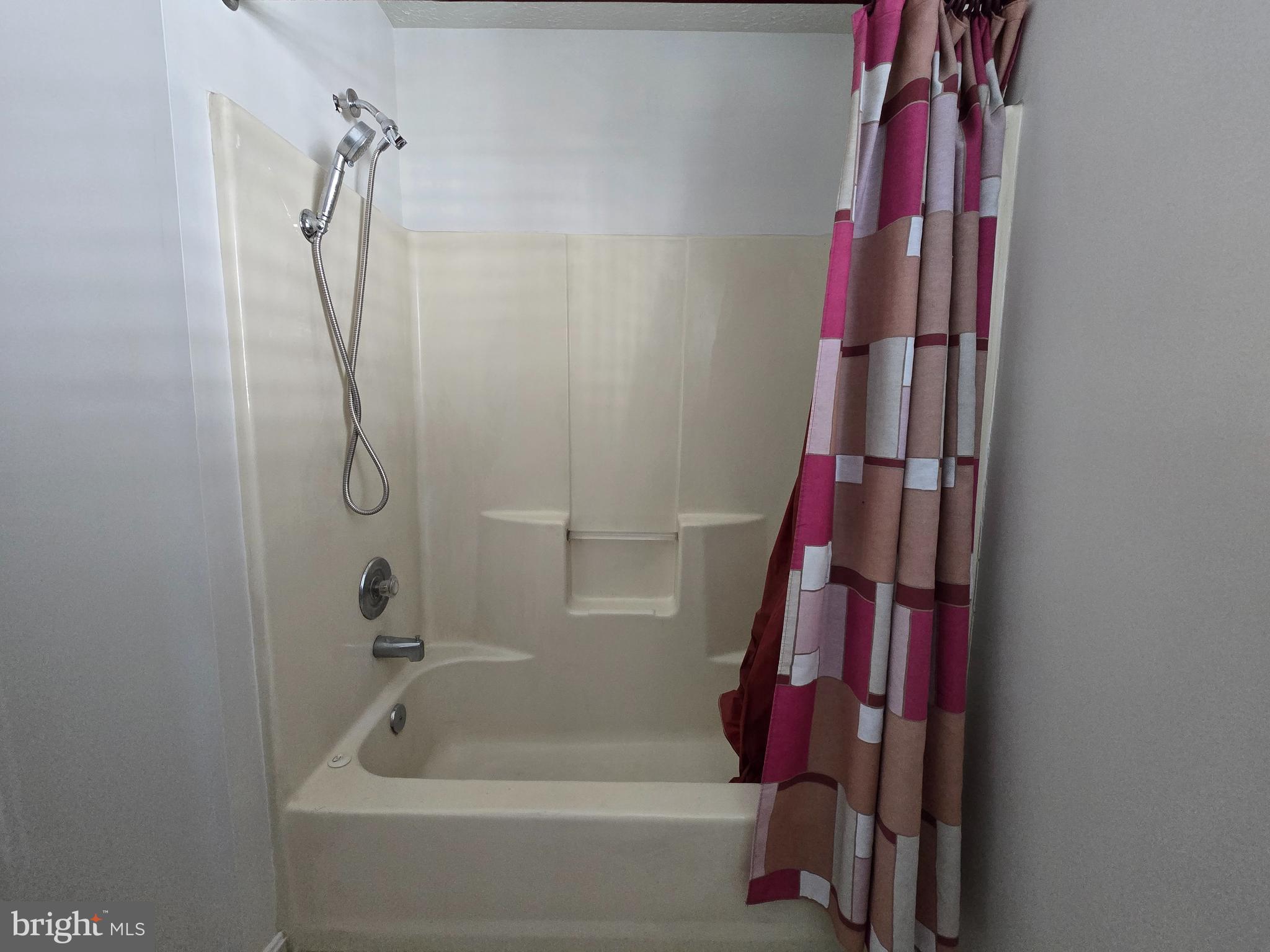 8907 Chad Way Clinton, MD 20735 - Photo 14 of 48 a bathroom with a bathtub and a shower