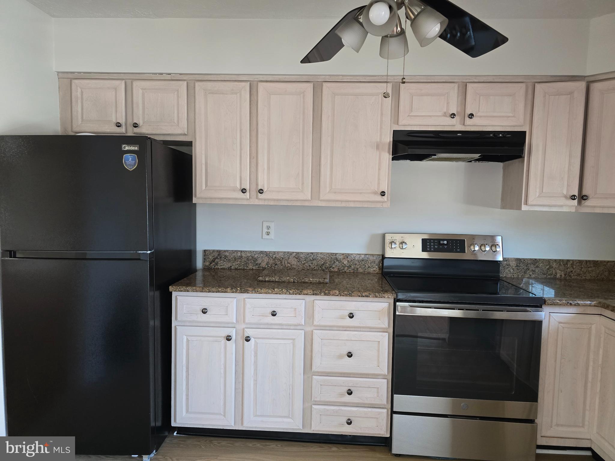 8907 Chad Way Clinton, MD 20735 - Photo 21 of 48 a kitchen with granite countertop white cabinets and stainless steel appliances