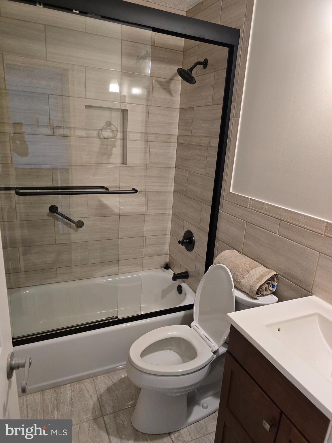 8907 Chad Way Clinton, MD 20735 - Photo 26 of 48 a bathroom with a sink toilet and shower