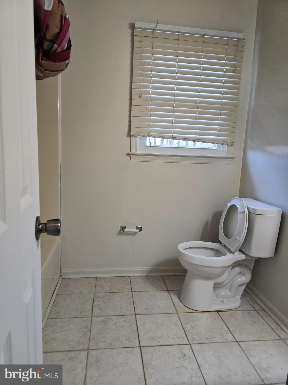 8907 Chad Way Clinton, MD 20735 - Photo 28 of 48 a white toilet sitting next to a bathroom sink