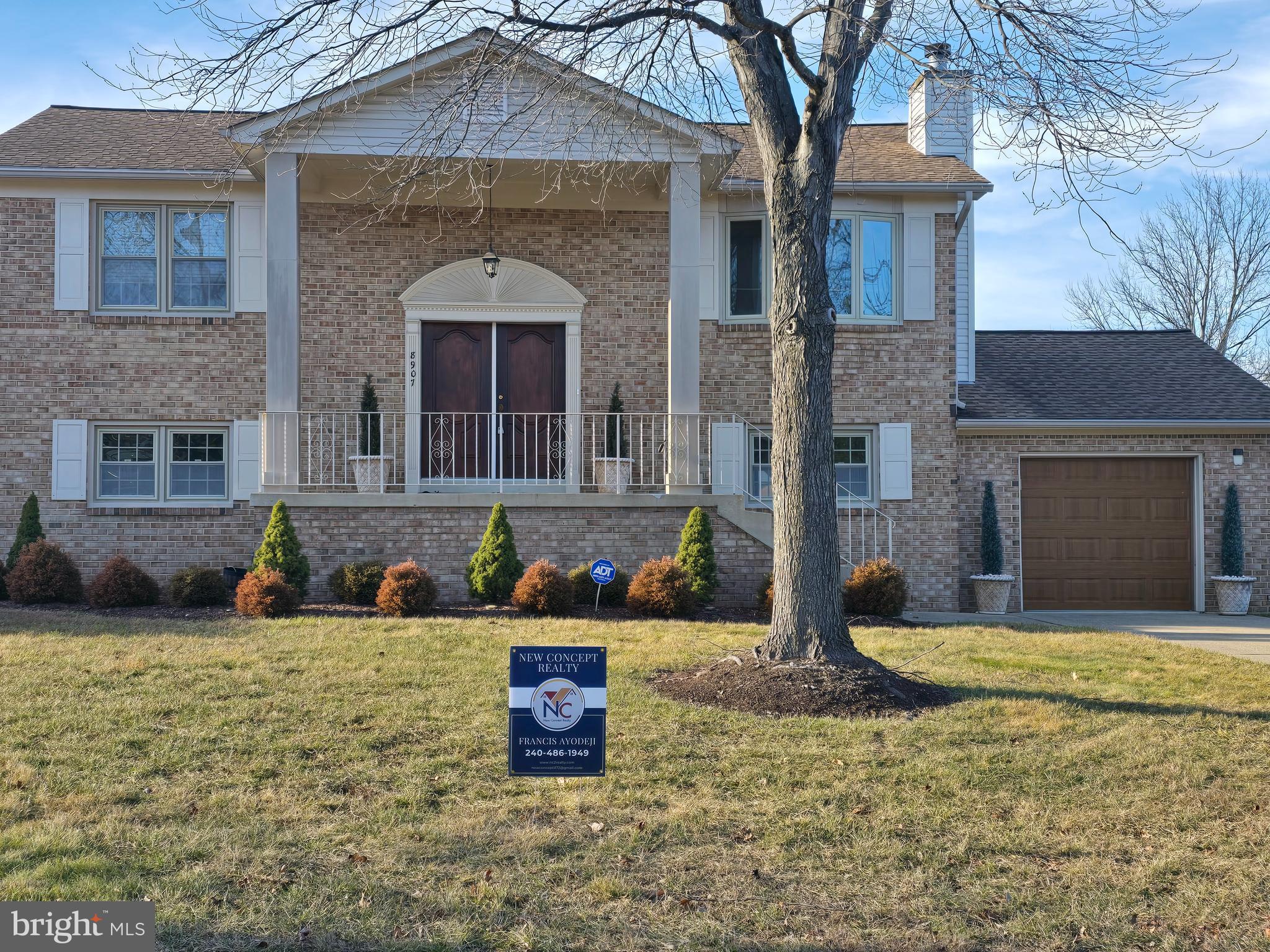 8907 Chad Way Clinton, MD 20735 - Photo 29 of 48 a front view of a house with yard and parking space