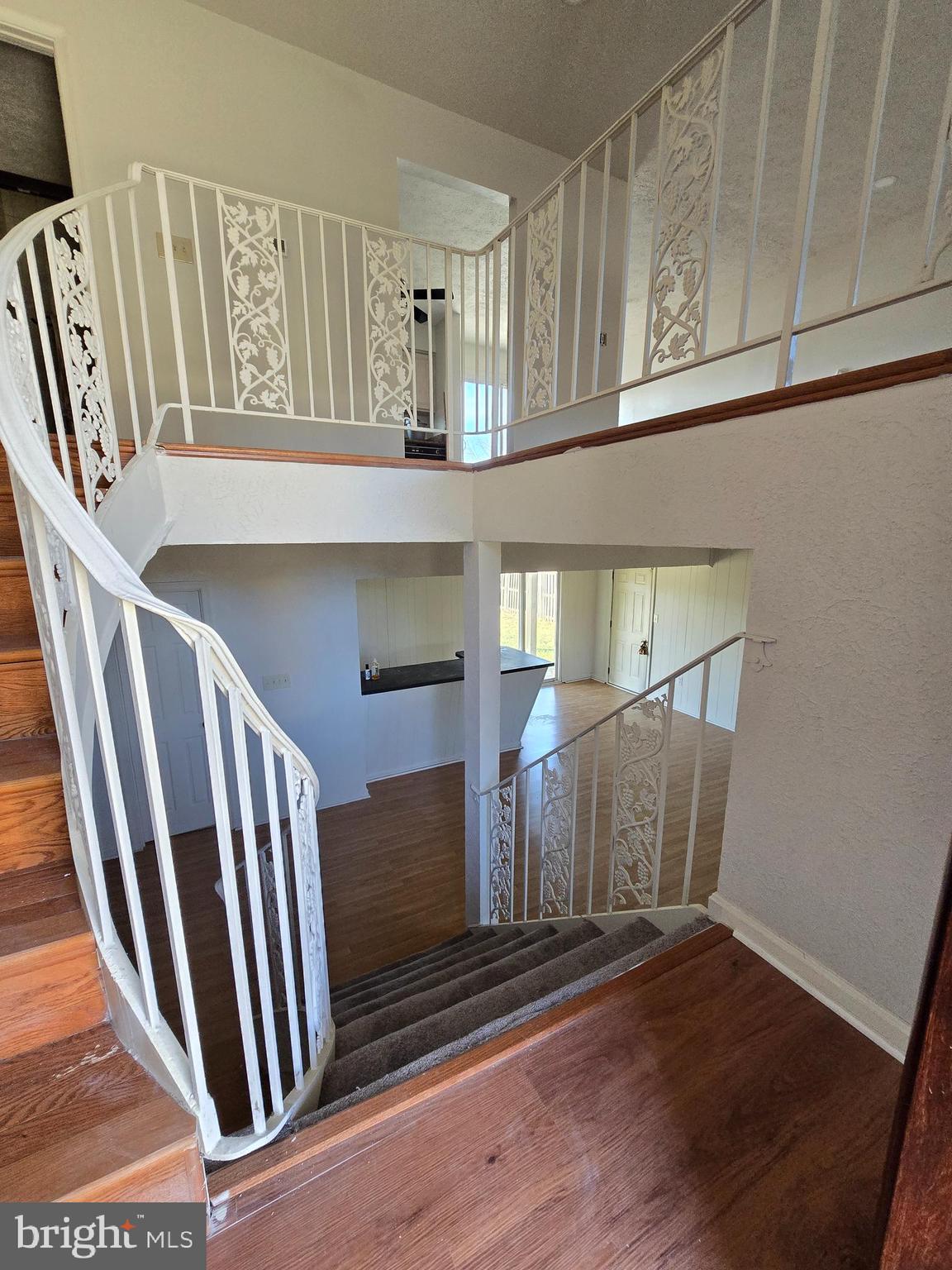 8907 Chad Way Clinton, MD 20735 - Photo 3 of 48 a view of staircase with wooden floor and stairs