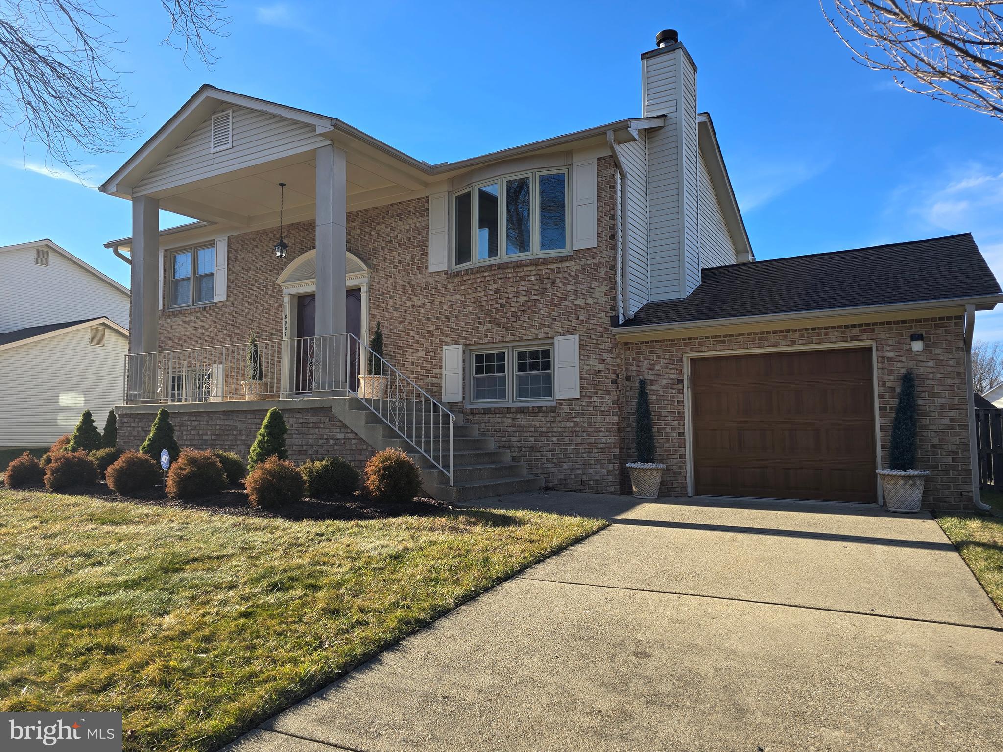 8907 Chad Way Clinton, MD 20735 - Photo 37 of 48 a front view of a house with a yard