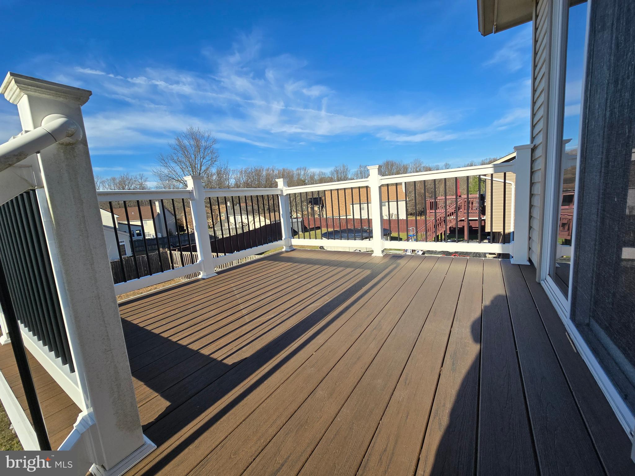 8907 Chad Way Clinton, MD 20735 - Photo 42 of 48 a view of a balcony with wooden floor