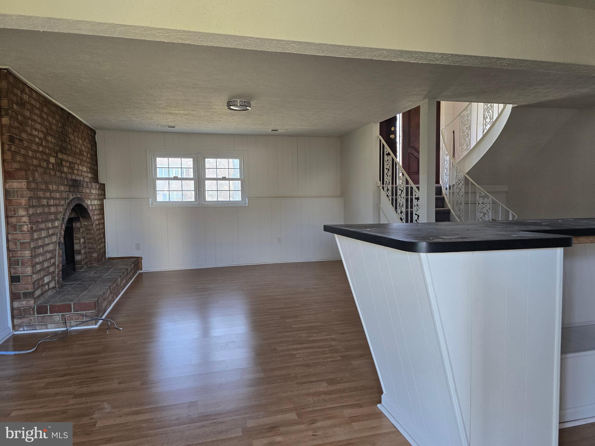 8907 Chad Way Clinton, MD 20735 - Photo 43 of 48 a view of a livingroom with wooden floor and fireplace