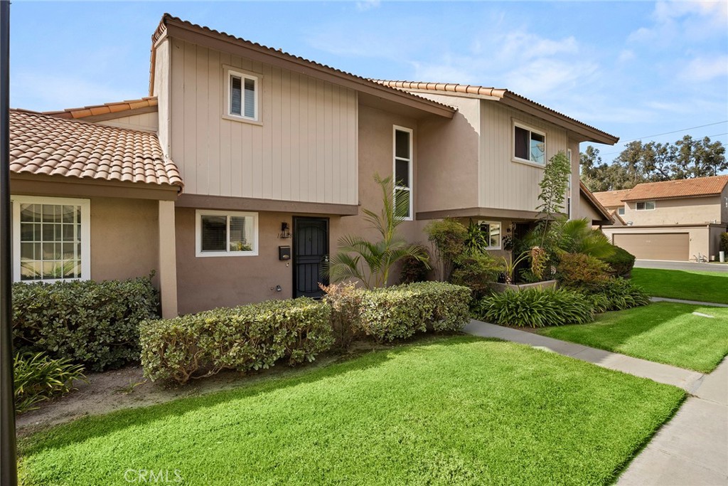 10538 Juniper Way Stanton, CA 90680 - Photo 2 of 2 a front view of a house with a garden