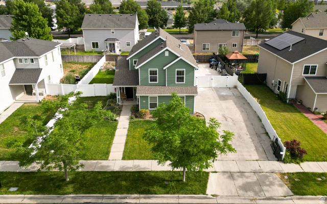1443 West 250 North Springville, UT 84663 - Photo 5 of 23 Two-story residence featuring a gabled roof and green siding