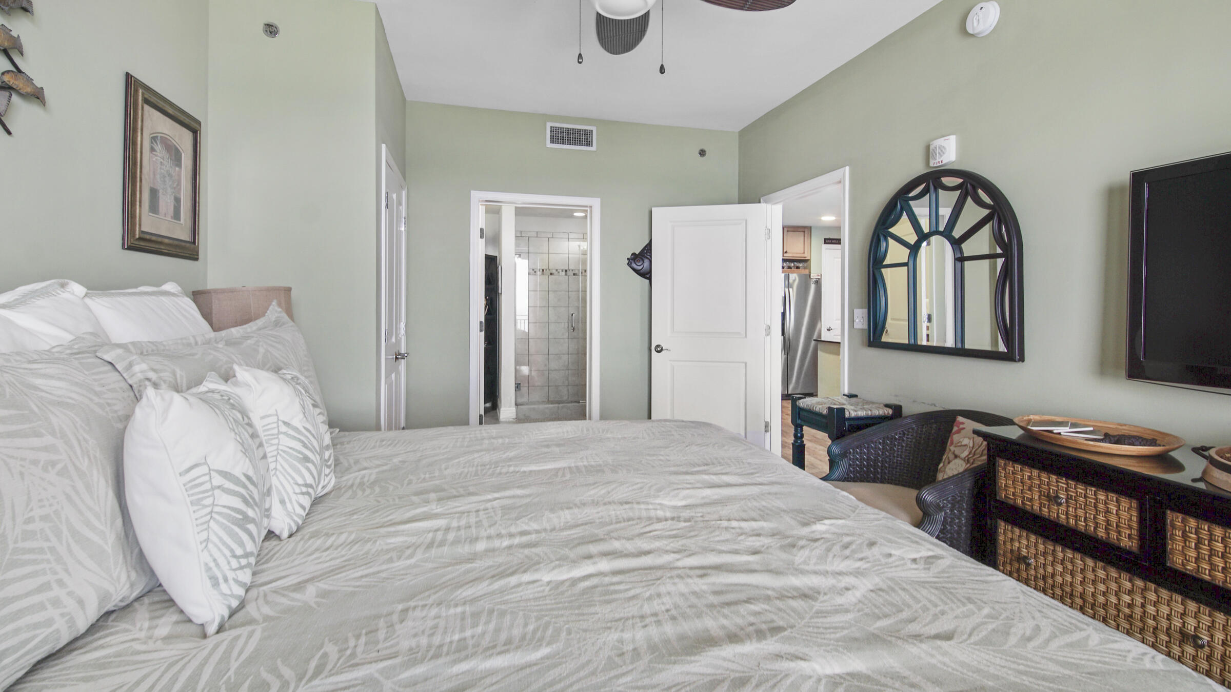16701 Front Beach Road, Unit 1502 Panama City Beach, FL 32413 - Photo 13 of 33 a bedroom with double bed and a dresser